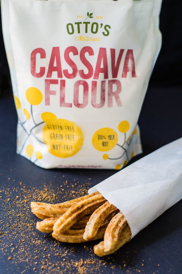 Bag of AIP compliant churros in front of a bag of cassava flower
